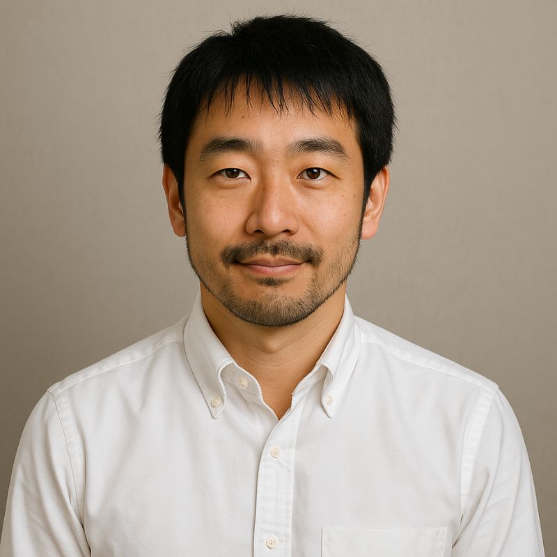 Portrait of an engineering lead in industrial automation from Japan, wearing a navy blazer and light blue shirt
