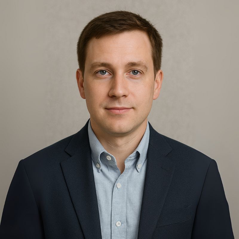 Portrait of a product manager in a US-based smart home brand, wearing a navy blazer and blue shirt