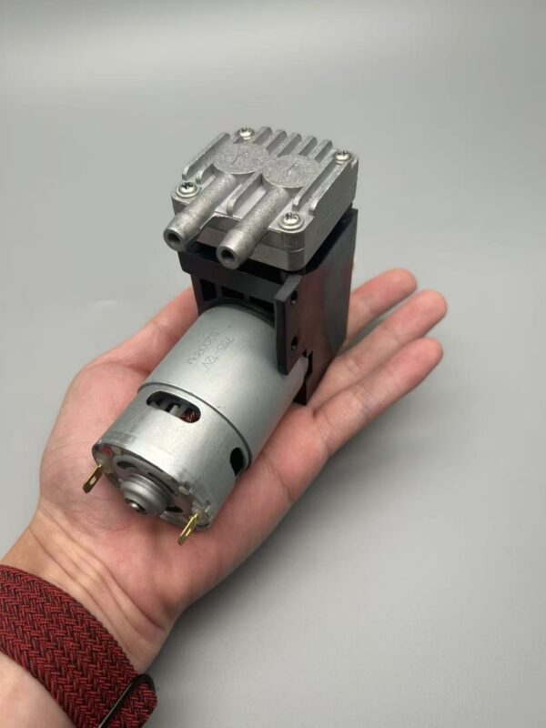 JSGDCPUMP JSG-07 brushed pump held in a hand