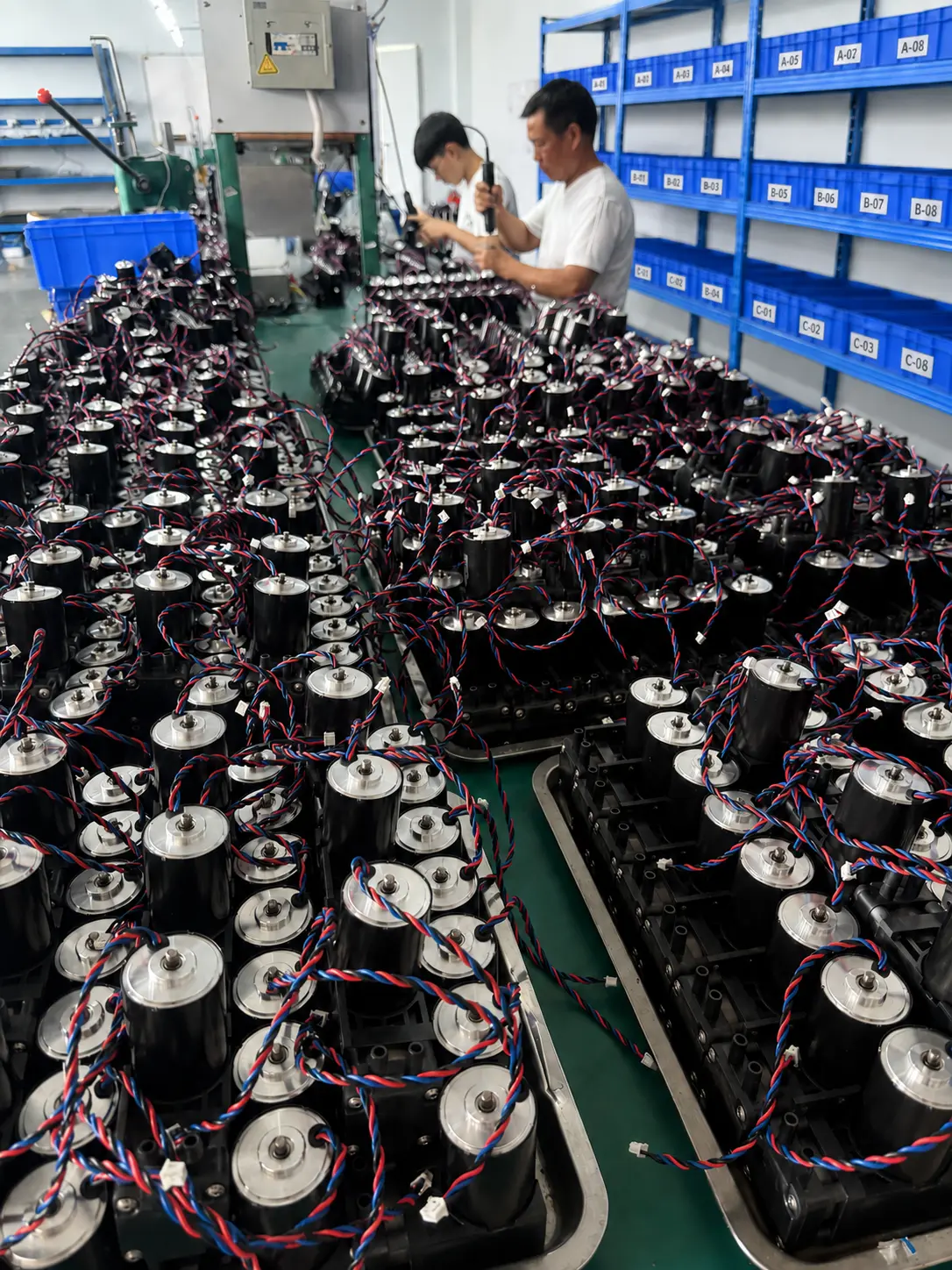 JSG miniature pump batch production with labeled material bins in the Shenzhen factory